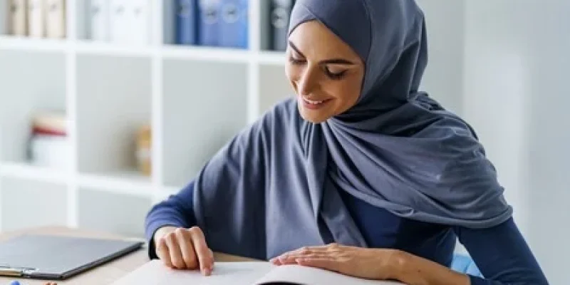 120815327-beautiful-muslim-woman-reading